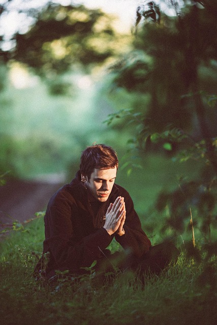 Person practicing mindfulness in a peaceful natural setting.
