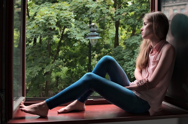 woman sitting by window