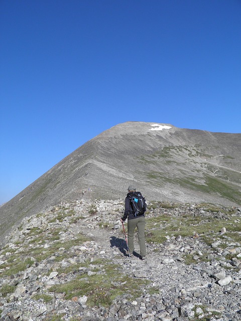 man climbing a mountain