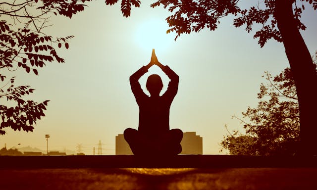 person meditating outdoor